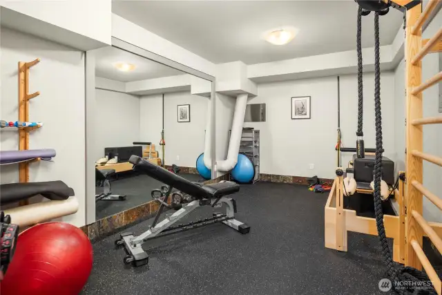 Gym with TV, Sonos Sound System & floor length mirrors.