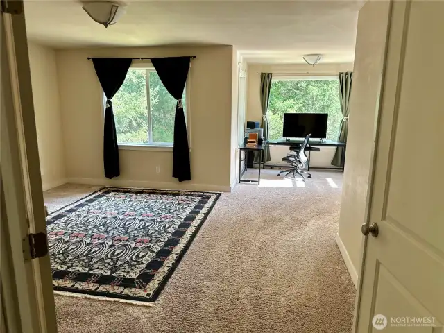 Main/primary bedroom with bath and walk in closet space