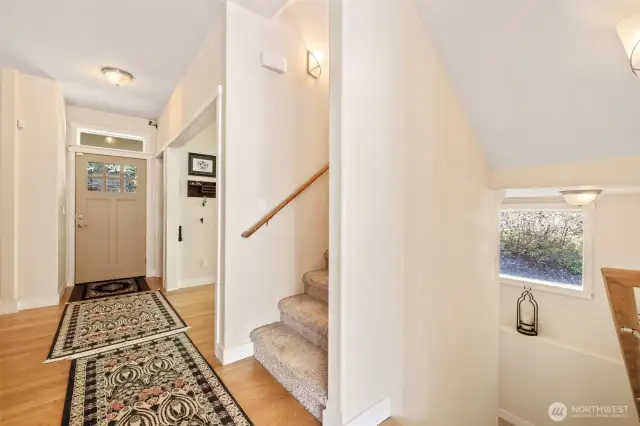 Main floor entry. Stairs up lead to bedrooms and down to the finished daylight basement.