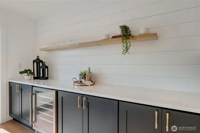 Counter space is not problem here, with the expanded galley kitchen stretching into the dining this is an entertainers dream space. Open bright and gorgeous quartz slab counters are the backdrop to this beautiful dining room!