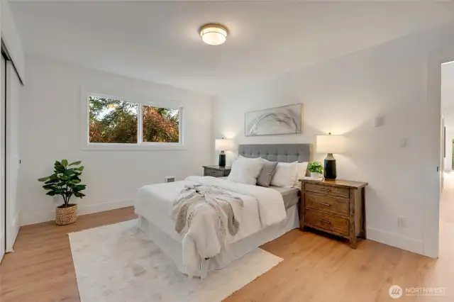 Generously sized primary suite offers plenty f space for a king sized bed and furnishings to make this space a retreat!