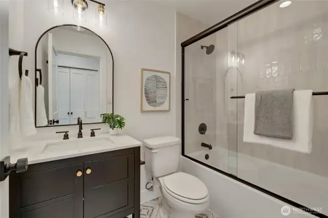 Perfectly appointed hall bath with stunning new materials and designer tile. Full bath features, all the necessary elements to make this space a show-stopper.