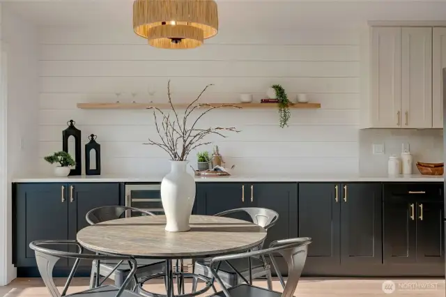 Gorgeous, bar, stunning materials, new throughout and waiting to for you to come check it out! This beautiful new dining space and expanded kitchen is stunning, complete with all appliances, quartz slab countertops, bedrosian tile backsplash, shiplap wall and floating shelves.