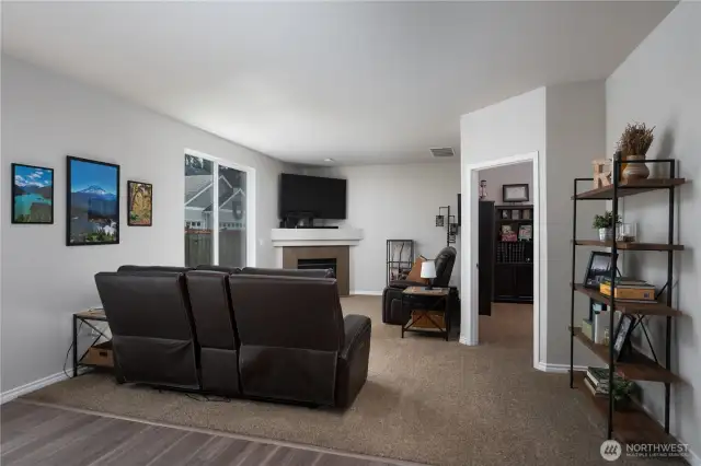 Off of the kitchen is another cozy living area.