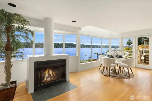 Expansive windows frame breathtaking views of the tranquil lake.