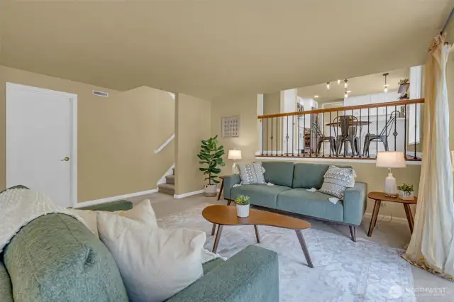 Additional view of lower level living space. Door leads to the 2-car garage with additional storage