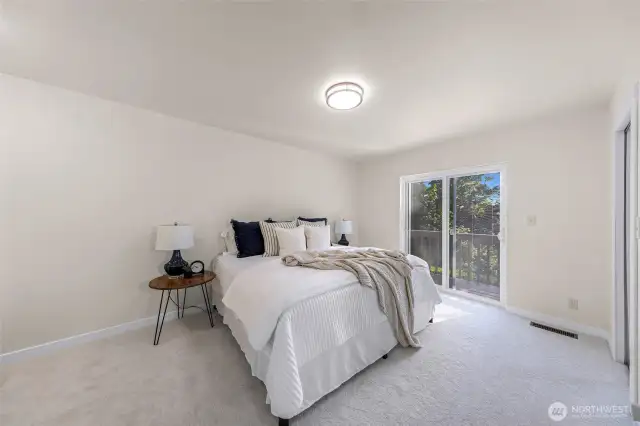 Primary Bedroom with sliders that lead to ocean view balcony