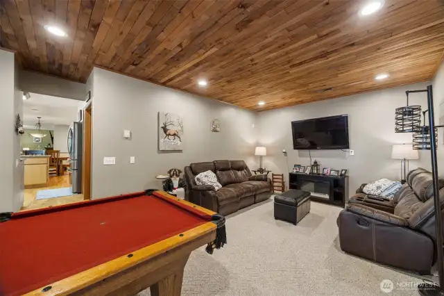 Looking across the pool table toward the kitchen.