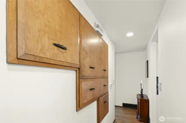 Period hallway built-ins are extra deep and slide-out for tons of "surprise" storage.