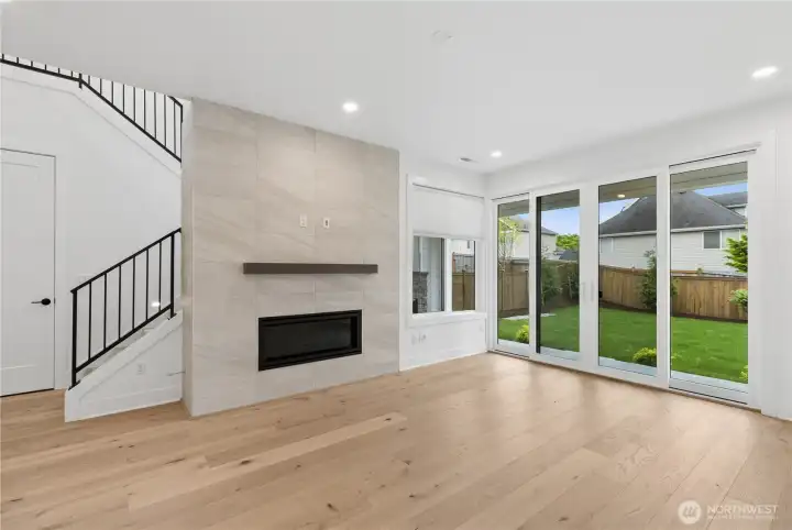 Living area w/Gas Fireplace and extensive metal open railing