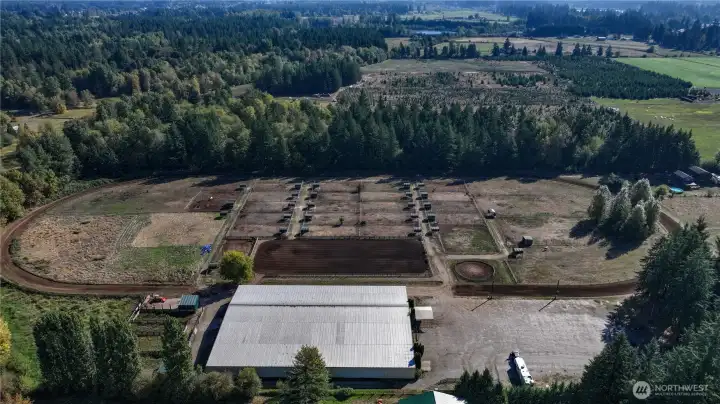 The 37+ level acres with a 220 X 100 indoor arena with 30 stalls, 265 X 115 outdoor arena, 28 paddocks with shelters, H&C wash rack, 1/2 mile track, cattle pens, round pen, ample lighted parking for events along with a modest residence is the ideal opportunity to experience the ultimate horsemen's dream!
