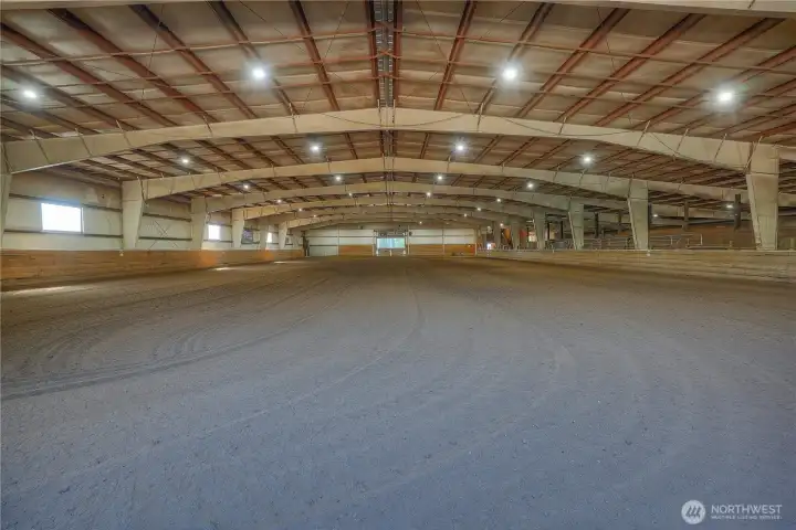 One of the larger indoor arenas in the PNW - The Flying M Stables offers, an obstacle trail course, jumps & rails, gaming equipment & a timer with barrel laser eyes mounted to the ceiling for the turn key equestrian event center.