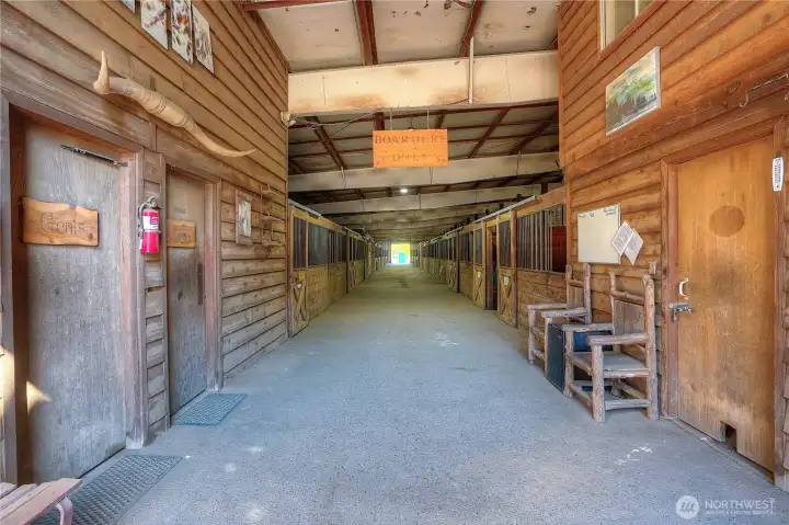 Main-show barn entry - on the left you will find two heated restrooms with hot water. The door on the right is the barn office/owner tack/storage room. Beyond are 30 matted stalls - (2) 12X16 and (28) 12 x12