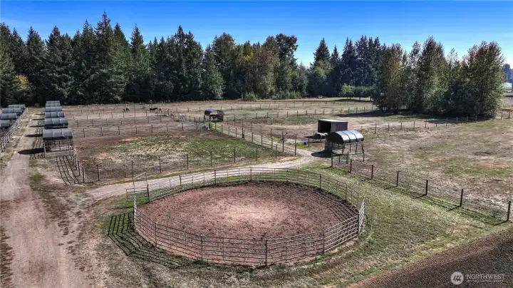 Round pen with sheltered paddocks are beyond.
