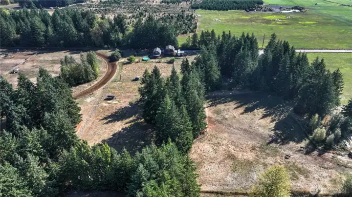Overhead view looking to the east - below you will see the overflow parking, and pasture adjacent to the owner's barn.