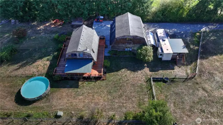 The residence - home, detached garage, established grounds, garden area, loads of fruit trees, pool & critter area!