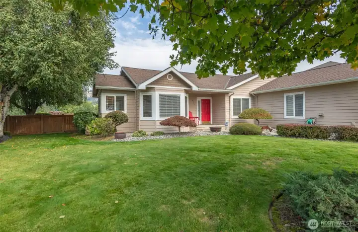 Mature trees & attractive landscape surround this lovely home.