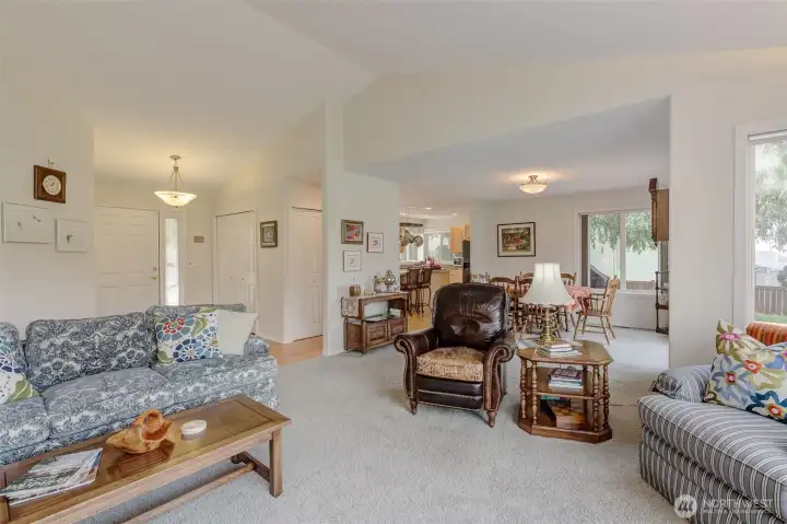 Living Room flows from gracious Foyer and into the Dining Room and beyond...