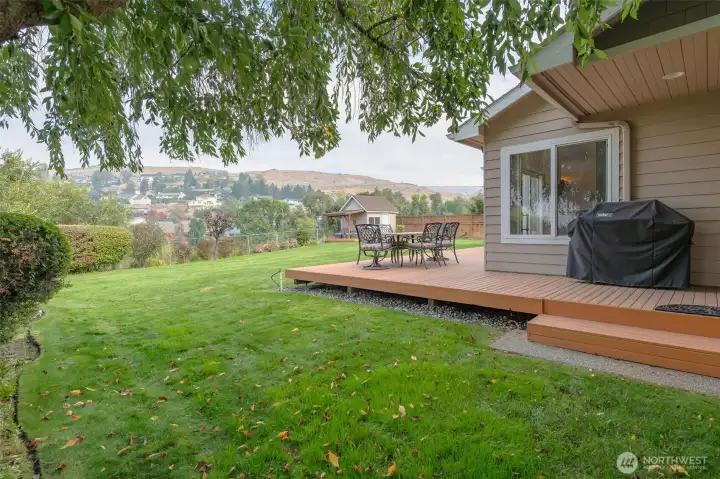 Deck even wraps around the kitchen side to bask in cool summer shade trees!
