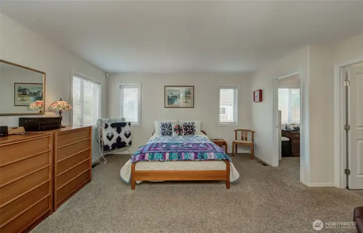 Step into a large primary suite facing the back yard views!