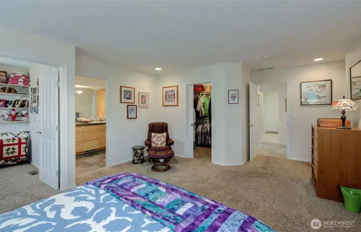 Primary suite offers an attached den/office (left), ensuite bath with dual vanity, and deep walk-in closet. Also a built-in library (not shown).