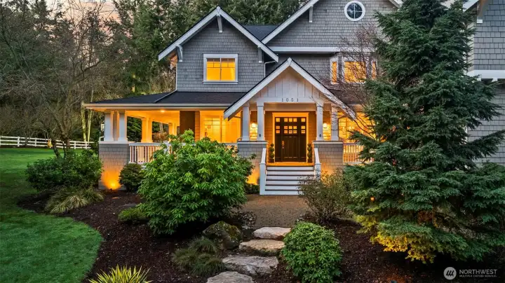 A grand welcome to one of Fox Island’s most coveted gated communities. This meticulously maintained sanctuary features a brand-new roof and unmistakable Hamptons-inspired curb appeal.