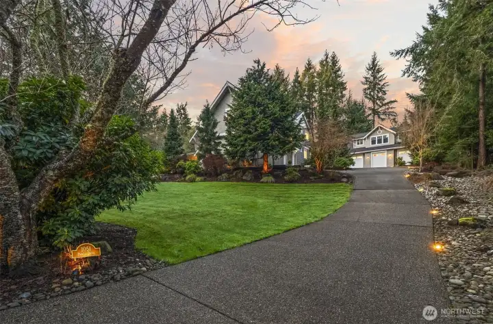 Beyond the attached garage, the detached 1,800 SF showroom stands as a masterpiece for the auto enthusiast. Fully climate-controlled with professional lifts, it provides a gallery-quality home for a premier 10-car collection.