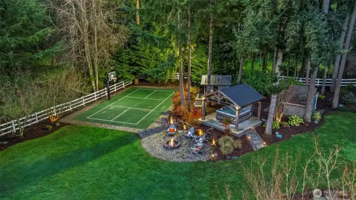 PNW leisure taken to new heights: a professional-grade, lighted sport court ready for pickleball or basketball under the stars.