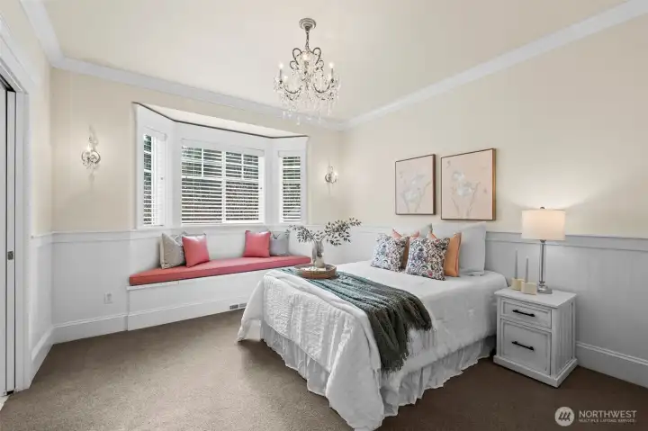 Elegance resides in every detail, from the crystal chandelier to the built-in window seat. This refined guest suite exemplifies the home's mint-condition craftsmanship and sophisticated coastal flair.