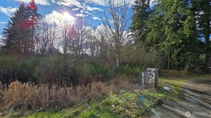 Shared driveway; property located left of the gate.