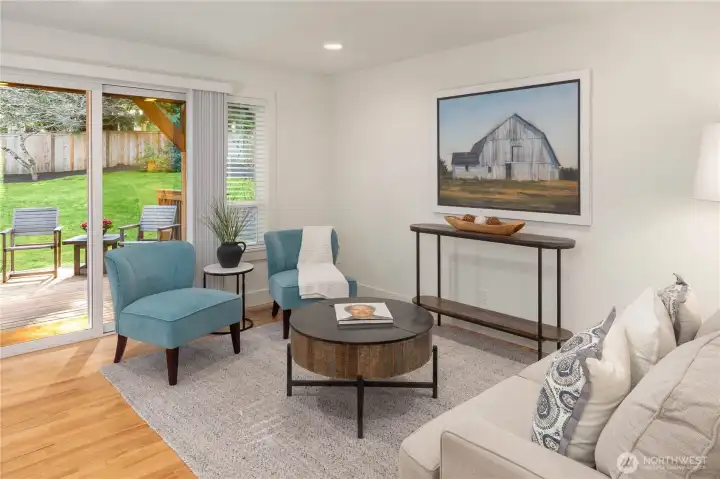 Family room sliders connect to the stunning backyard.