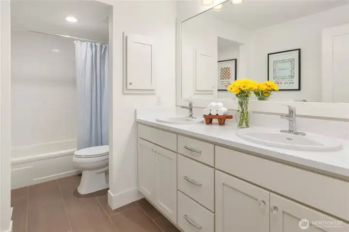 Dual sinks and a suite of thoughtful details in this new bath.