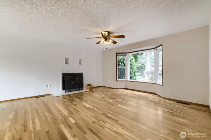 Newly refinished hardwoods and a wood burning fireplace.