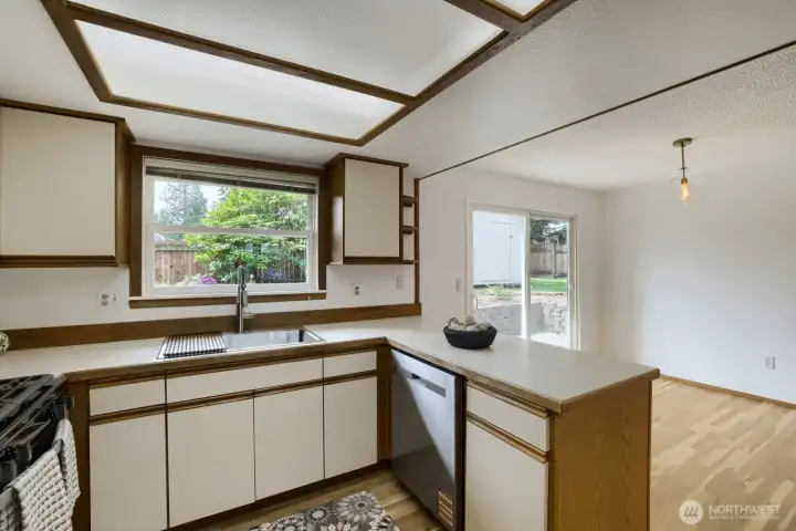 New gas range, stainless sink, dishwasher and fridge