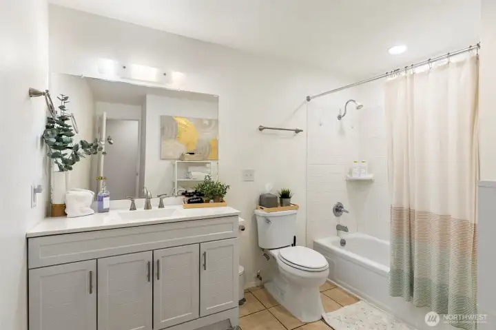 Spacious bathroom with a new vanity.