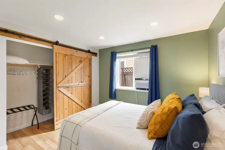 Second bedroom mural: Bremerton ferry, whales, and a postage stamp dated twit the date sellers purchased.