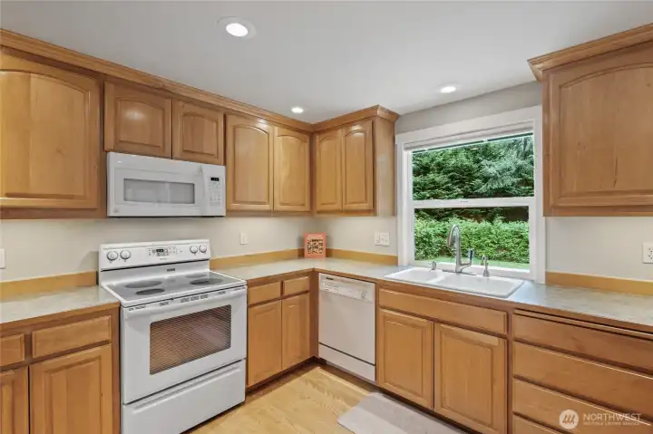 Kitchen looks out to the fabulous back yard.