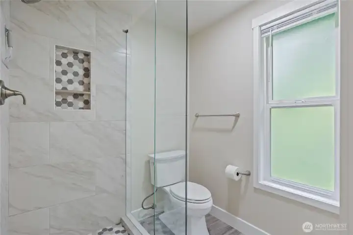 Beautifully updated shower in primary bath.