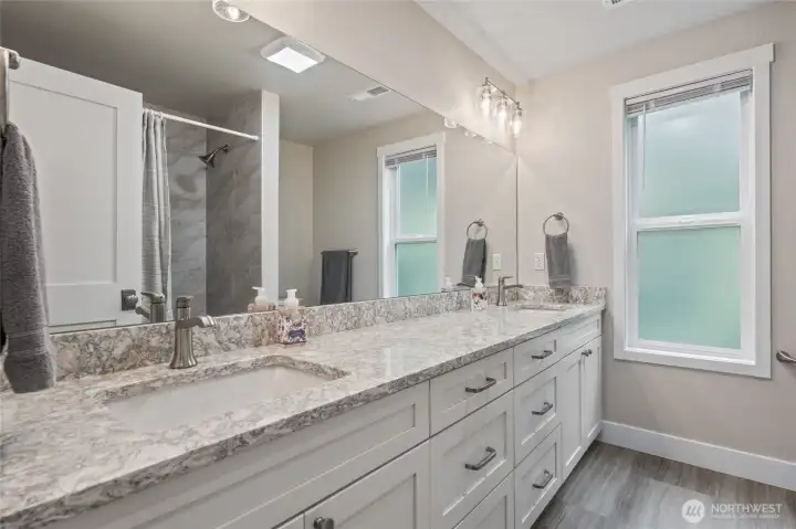 Updated hall bathroom with plenty of counter space and 2 sinks. Tub/shower combo is updated as well.