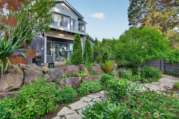 Welcome to 7700 California Ave SW, where a private yard space showcases you can have your own garden oasis and not sacrifice on location!