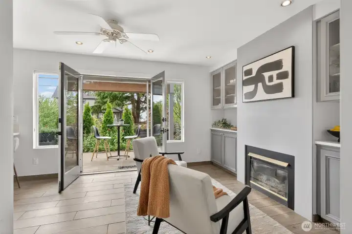 French doors throughout the main level create seamless indoor-outdoor connection and abundant light