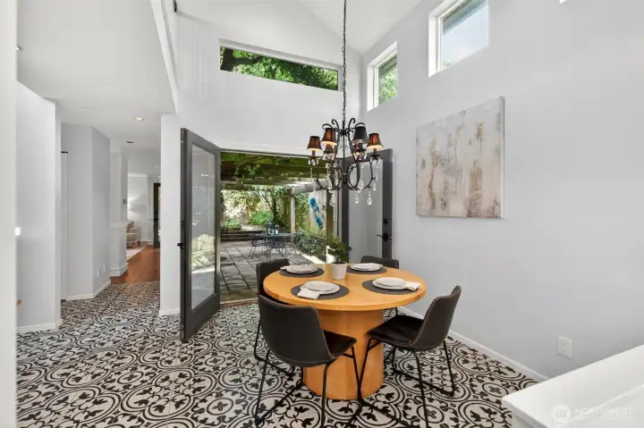 French doors opening directly onto the courtyard, blurring the line between indoor and outdoor living