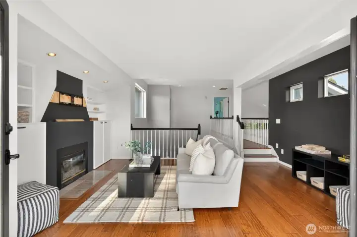 The lofted upstairs sitting room — an elevated retreat with soaring ceilings and an airy feel