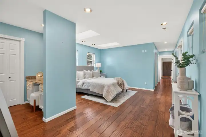 A spacious primary bedroom retreat with ensuite bathroom and private south-facing balcony