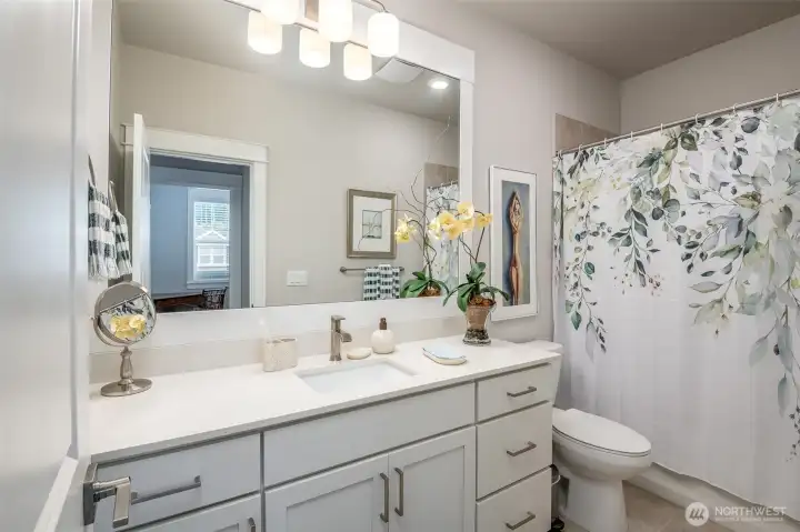 This full bathroom at the front of the house is perfect for overnights guests.