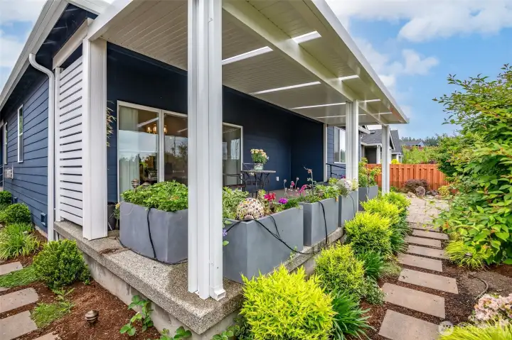 The outdoor living spaces are designed for both relaxation and functionality.