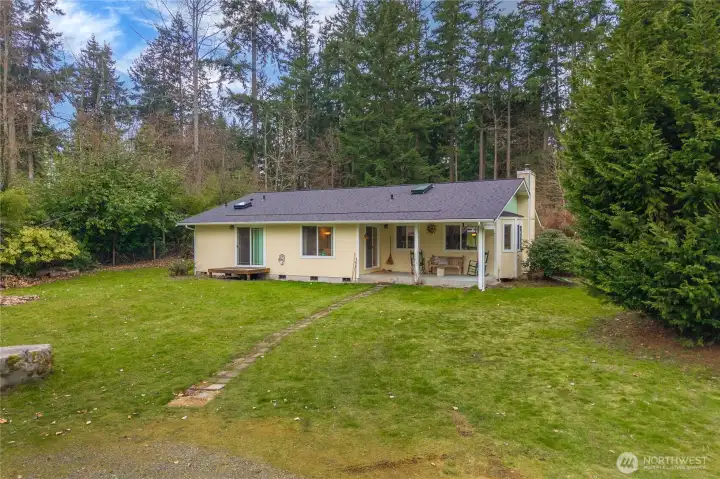 Covered back porch overlooking your private acreage