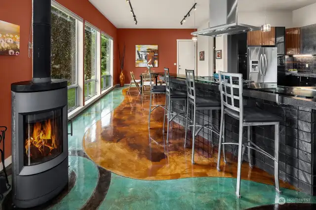 Custom stained concrete floors with radiant heat. European soapstone freestanding stove. Heat-resistant with constant heat radiation benefits.