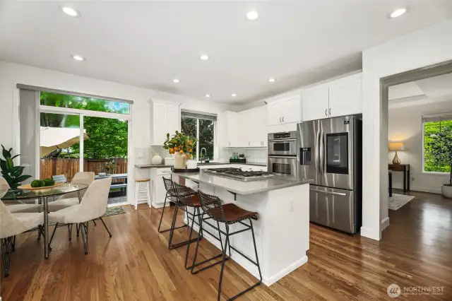 Beautiful kitchen with slab quartz counters.