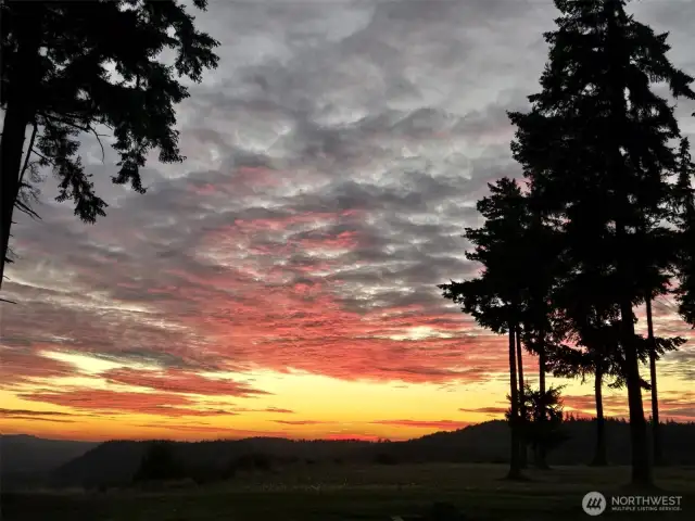 Sunset view as you look west from this incredible home.